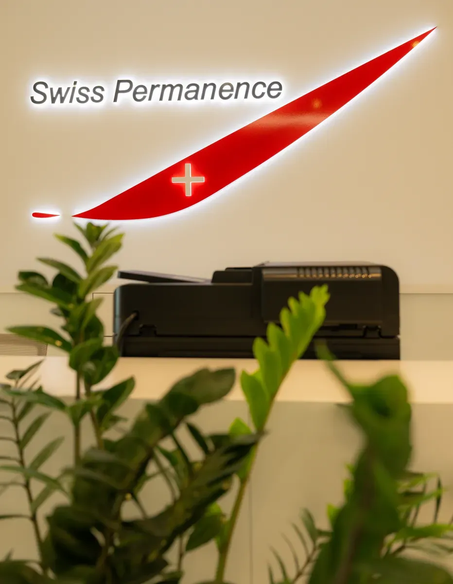 Reception with Swiss Permanence logo and planting